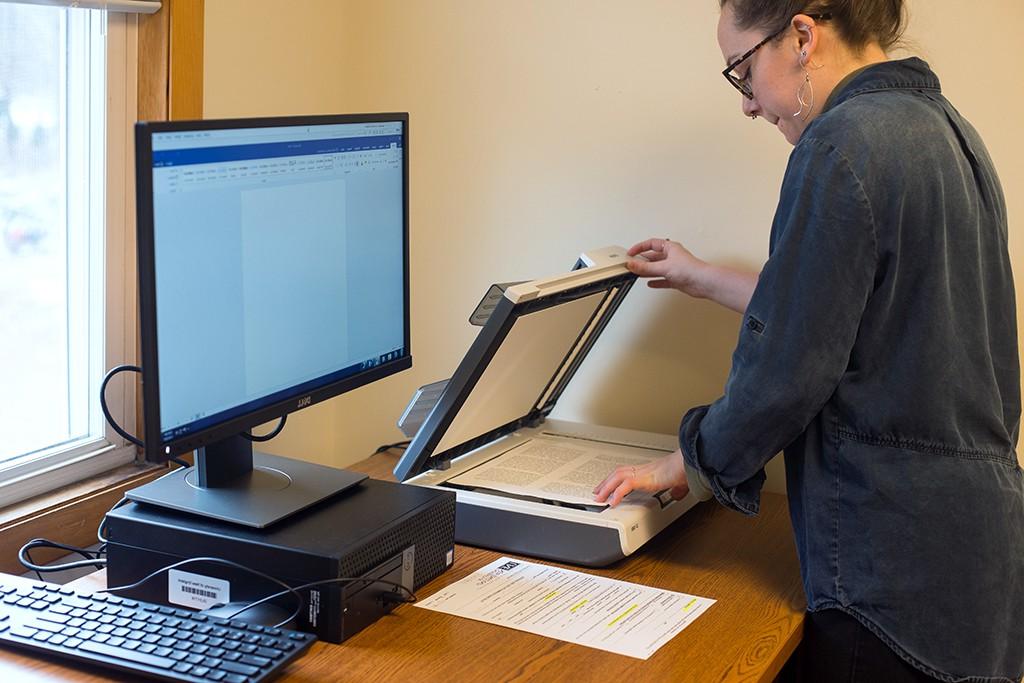 A student upload files to a computer via a scanner